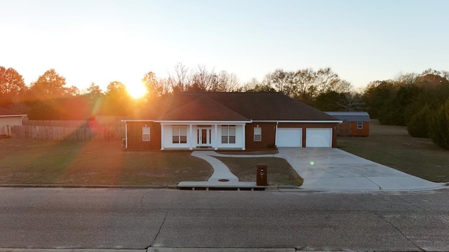 209 David Hussey Rd, Newton, AL 36352 - view of front facade with driveway, a garage, and a front lawn