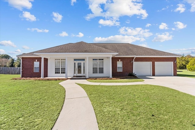 ranch-style house featuring a garage and a front lawn