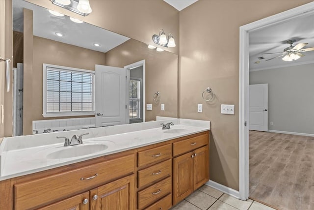 bathroom featuring vanity, tile patterned floors, ceiling fan, and ornamental molding