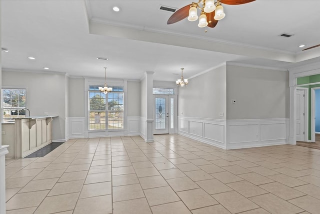 interior space featuring ornamental molding, french doors, ceiling fan with notable chandelier, and light tile patterned floors