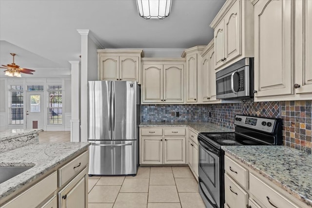 kitchen with light tile patterned floors, tasteful backsplash, crown molding, appliances with stainless steel finishes, and ceiling fan