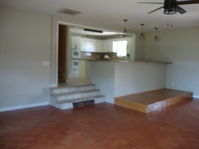 801 Early Walden Rd, Headland, AL 36345 - unfurnished living room featuring ceiling fan and baseboards