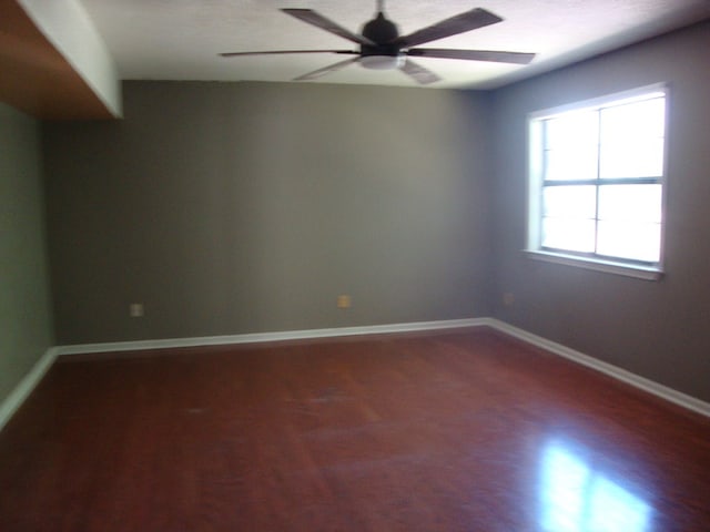 801 Early Walden Rd, Headland, AL 36345 - empty room with ceiling fan, wood finished floors, and baseboards