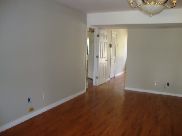 801 Early Walden Rd, Headland, AL 36345 - spare room with wood finished floors and baseboards