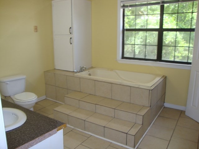801 Early Walden Rd, Headland, AL 36345 - full bath featuring healthy amount of natural light, toilet, vanity, and tile patterned floors