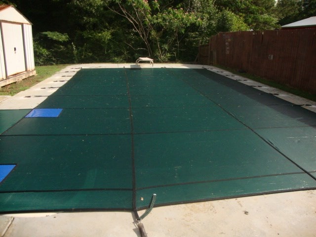 801 Early Walden Rd, Headland, AL 36345 - view of pool with a shed, fence, an outdoor structure, and a patio