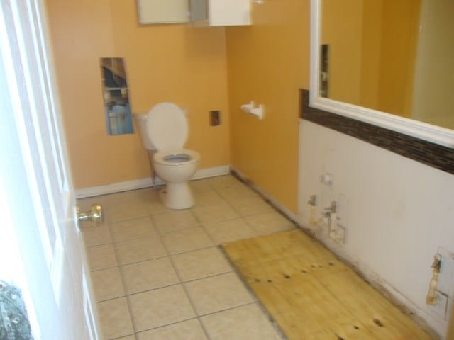 801 Early Walden Rd, Headland, AL 36345 - half bathroom with tile patterned flooring, toilet, and baseboards