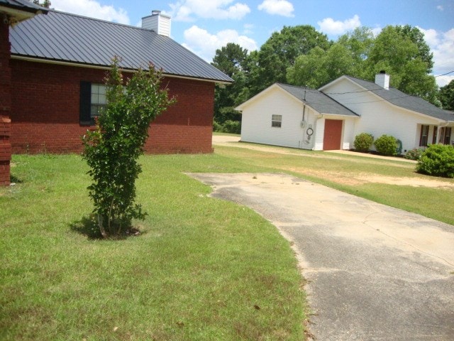 801 Early Walden Rd, Headland, AL 36345 - view of grassy yard featuring a garage