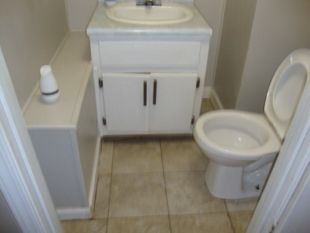 801 Early Walden Rd, Headland, AL 36345 - bathroom with vanity, toilet, and tile patterned flooring
