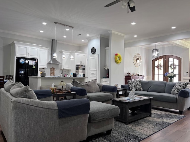 living area with dark wood-type flooring, crown molding, recessed lighting, and a ceiling fan