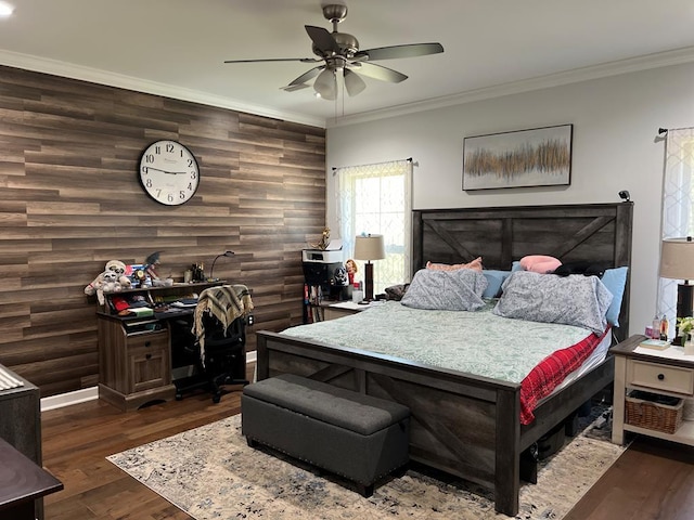bedroom with ceiling fan, baseboards, dark wood-style flooring, and ornamental molding