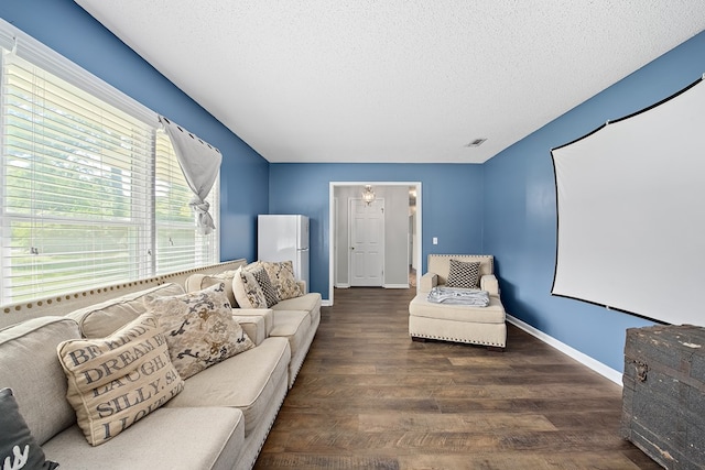 interior space with dark hardwood / wood-style flooring and a textured ceiling