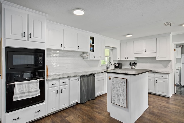 kitchen with black appliances, dark hardwood / wood-style floors, white cabinetry, and backsplash