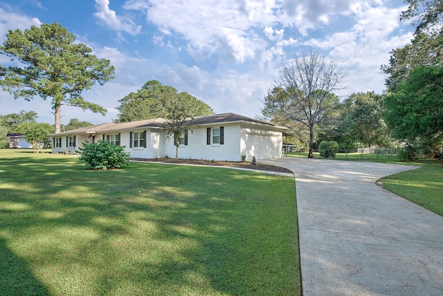 ranch-style home featuring a garage and a front lawn