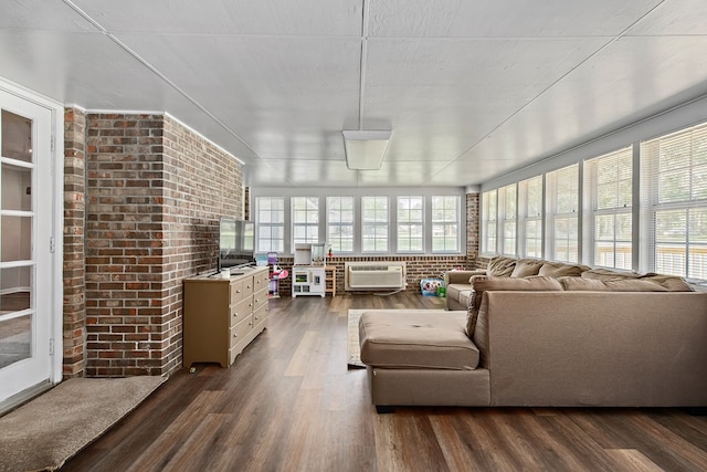 sunroom / solarium featuring a wall unit AC