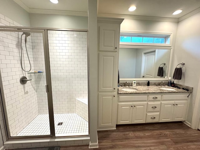 303 Courtland Dr, Dothan, AL 36301 - bathroom with a shower stall, wood finished floors, double vanity, ornamental molding, and recessed lighting