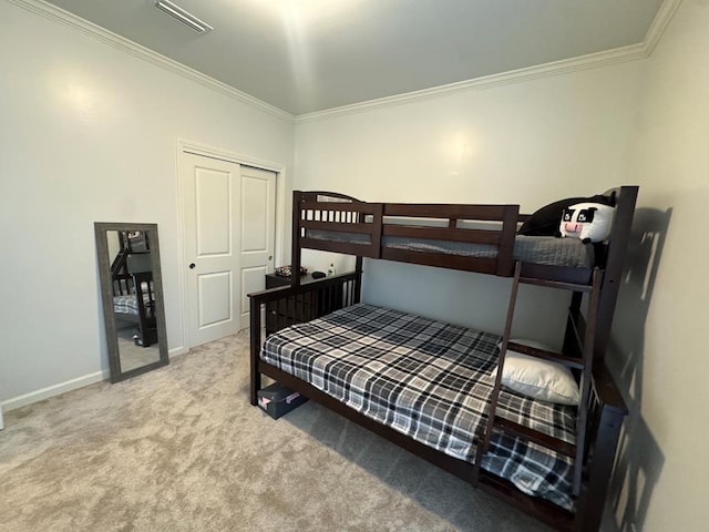 303 Courtland Dr, Dothan, AL 36301 - bedroom with ornamental molding, carpet, baseboards, and a closet