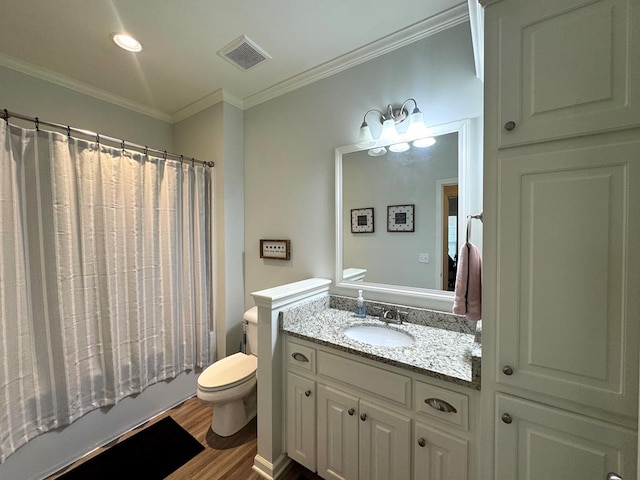 303 Courtland Dr, Dothan, AL 36301 - bathroom with wood finished floors, ornamental molding, toilet, vanity, and shower / bath combination with curtain