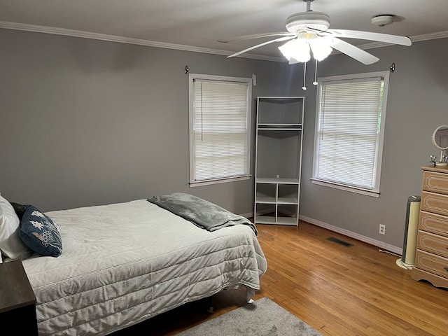 132 Ozark Rd, Abbeville, AL 36310 - bedroom featuring light wood-style flooring, crown molding, and ceiling fan