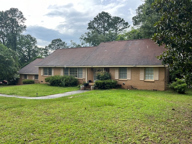 132 Ozark Rd, Abbeville, AL 36310 - view of front of property with brick siding, a front yard, crawl space, and roof with shingles