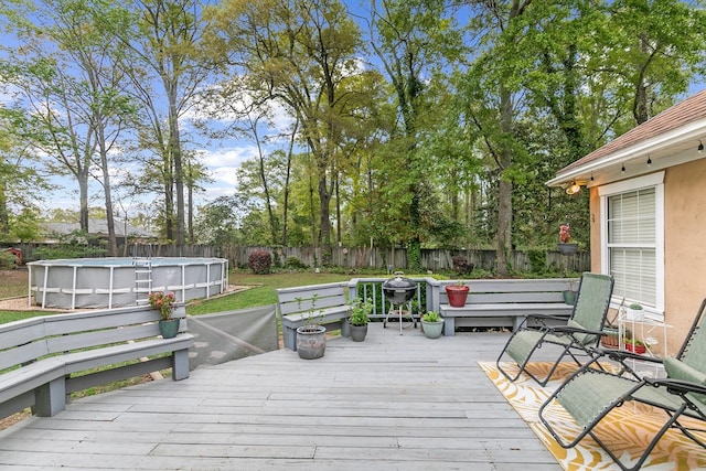 208 Willow Oaks Dr, Headland, AL 36345 - deck featuring a fenced backyard and a fenced in pool