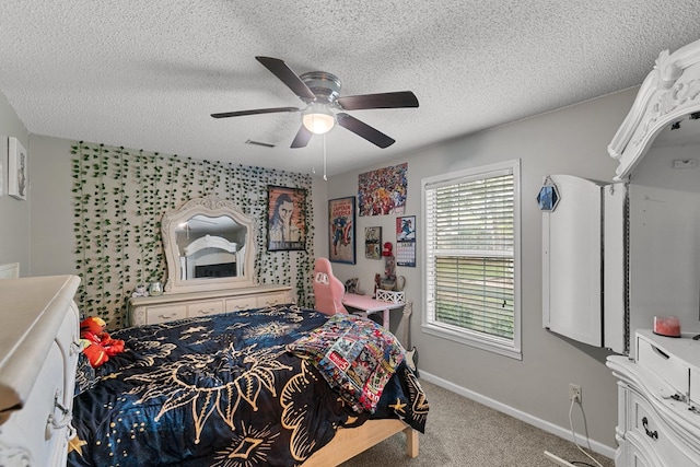 208 Willow Oaks Dr, Headland, AL 36345 - carpeted bedroom featuring visible vents, baseboards, a ceiling fan, and a textured ceiling