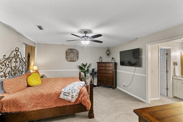 208 Willow Oaks Dr, Headland, AL 36345 - bedroom with visible vents, baseboards, light carpet, and a textured ceiling