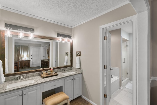 208 Willow Oaks Dr, Headland, AL 36345 - full bath featuring a sink, double vanity, a stall shower, and a textured ceiling
