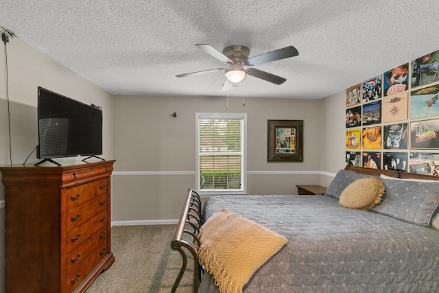 208 Willow Oaks Dr, Headland, AL 36345 - bedroom featuring ceiling fan, a textured ceiling, carpet flooring, and baseboards