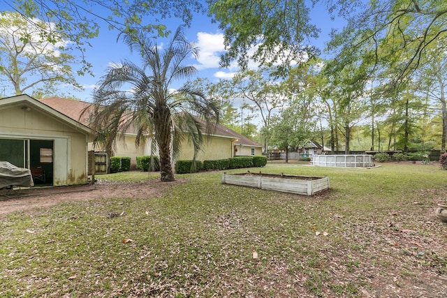 208 Willow Oaks Dr, Headland, AL 36345 - view of yard featuring fence and a vegetable garden