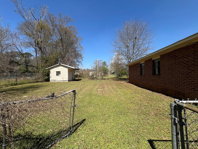 view of yard with an outdoor structure and fence