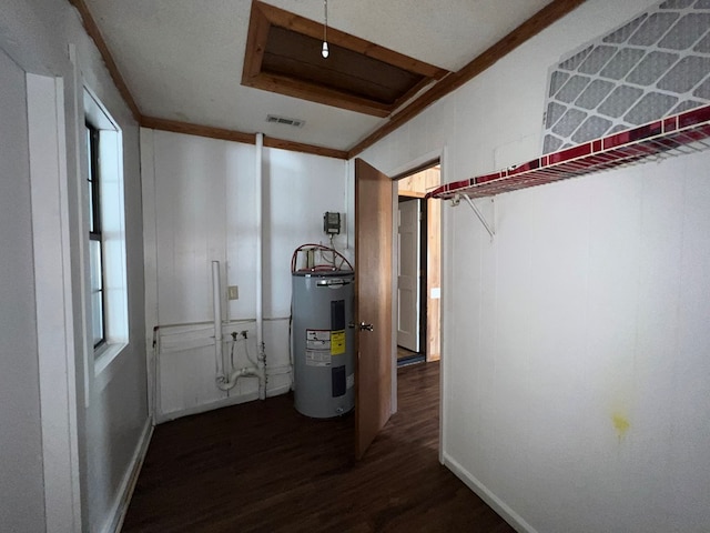 utility room featuring visible vents and water heater