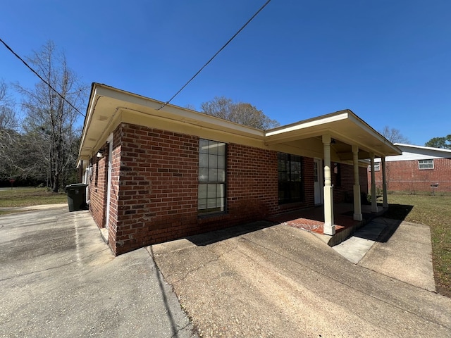 exterior space featuring brick siding