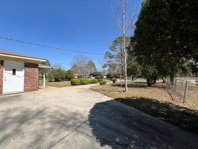 exterior space featuring concrete driveway