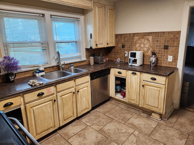 kitchen featuring tasteful backsplash, sink, light brown cabinetry, and dishwasher