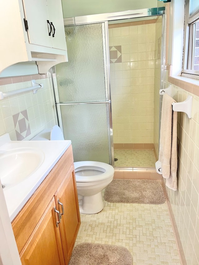 869 Bethlehem Rd, Midland City, AL 36350 - full bathroom featuring tile walls, vanity, and a stall shower