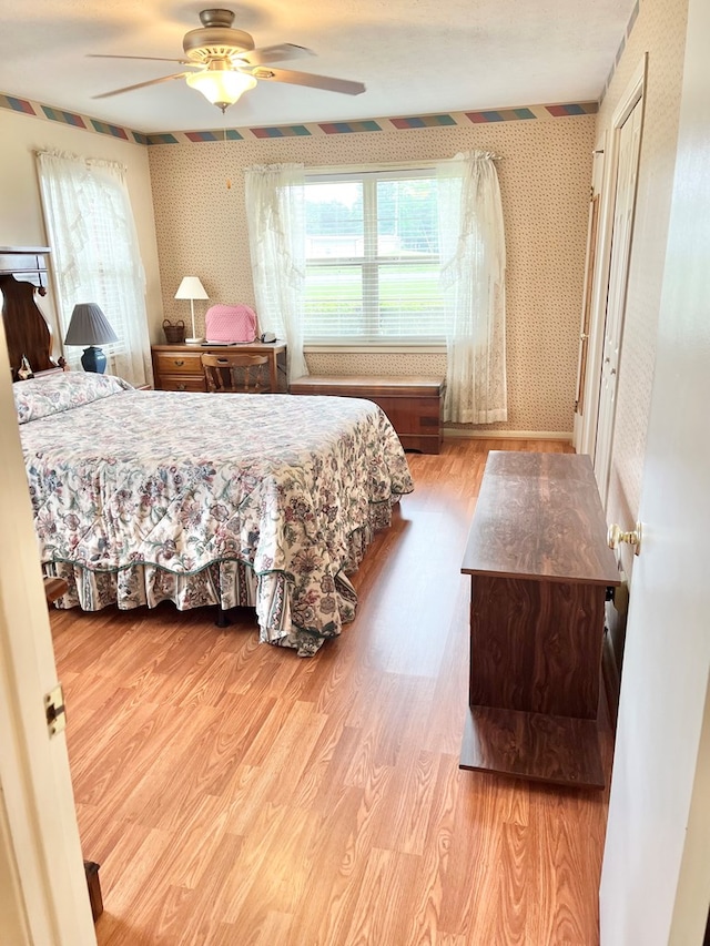869 Bethlehem Rd, Midland City, AL 36350 - bedroom with wallpapered walls, wood finished floors, and ceiling fan