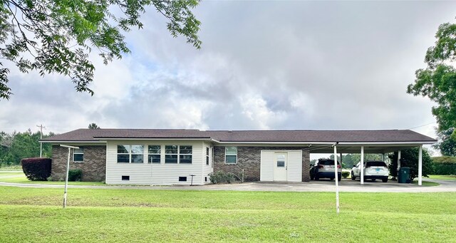869 Bethlehem Rd, Midland City, AL 36350 - view of front of property with a carport, a front yard, brick siding, and driveway