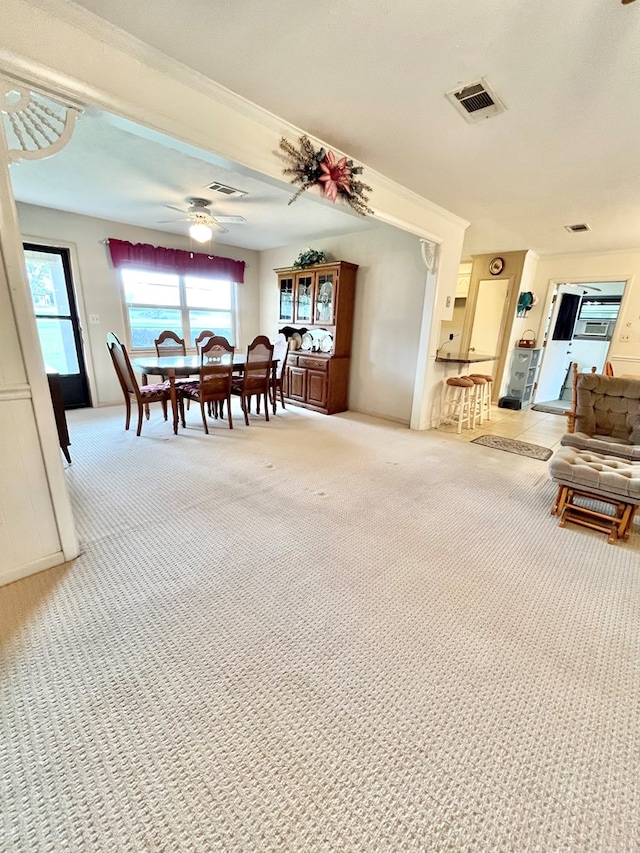 869 Bethlehem Rd, Midland City, AL 36350 - dining area with light carpet, crown molding, and ceiling fan