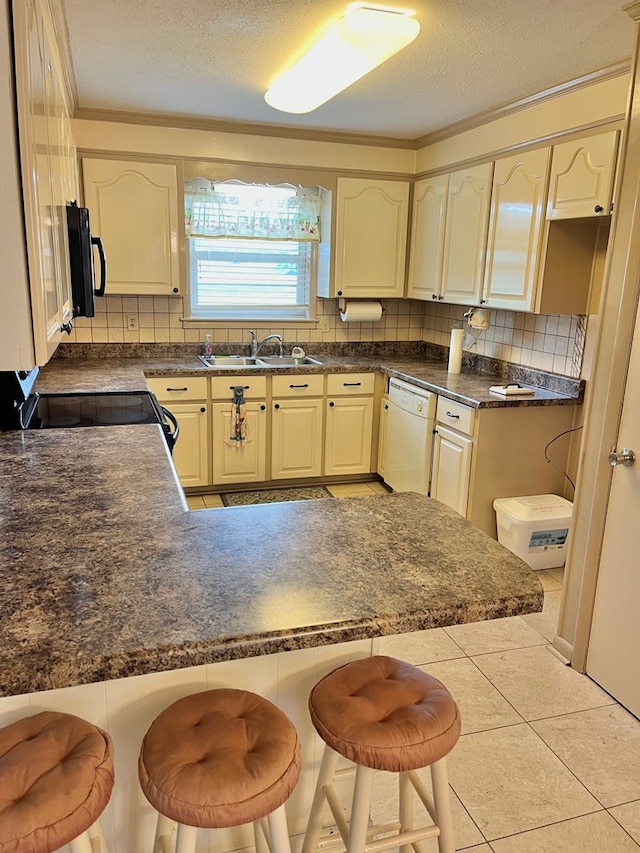869 Bethlehem Rd, Midland City, AL 36350 - kitchen with dishwasher, tasteful backsplash, a peninsula, dark countertops, and a textured ceiling