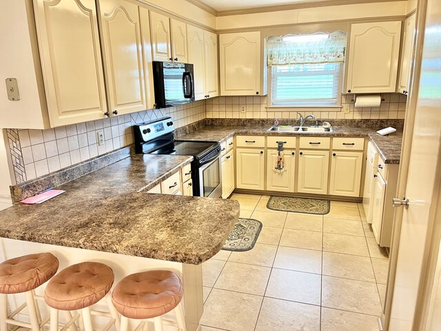 869 Bethlehem Rd, Midland City, AL 36350 - kitchen with black microwave, electric range, a peninsula, dark countertops, and crown molding