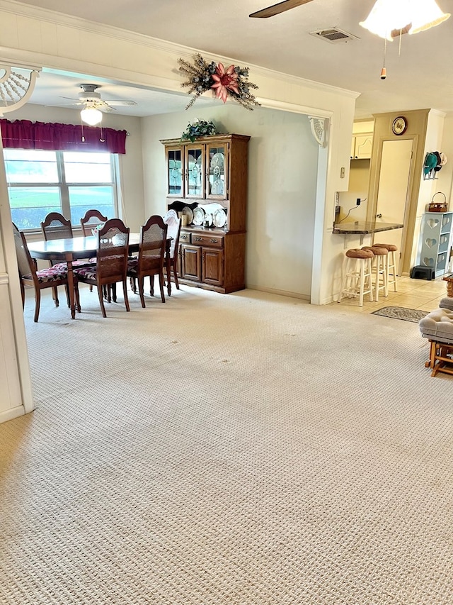 869 Bethlehem Rd, Midland City, AL 36350 - dining area with a ceiling fan, ornamental molding, and light colored carpet