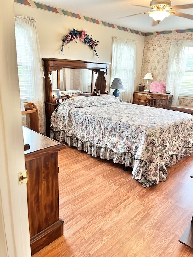 869 Bethlehem Rd, Midland City, AL 36350 - bedroom featuring wood finished floors, wallpapered walls, and ceiling fan