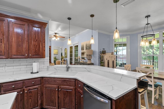 306 Halifax Dr, Dothan, AL 36305 - kitchen featuring dishwasher, crown molding, a peninsula, backsplash, and hanging light fixtures