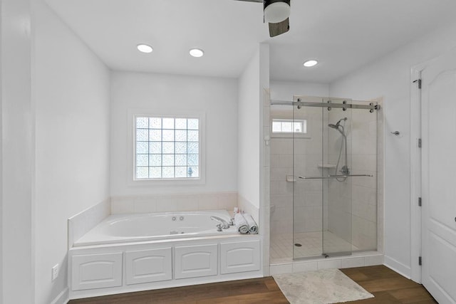 306 Halifax Dr, Dothan, AL 36305 - full bathroom with a bath, a stall shower, wood finished floors, recessed lighting, and ceiling fan