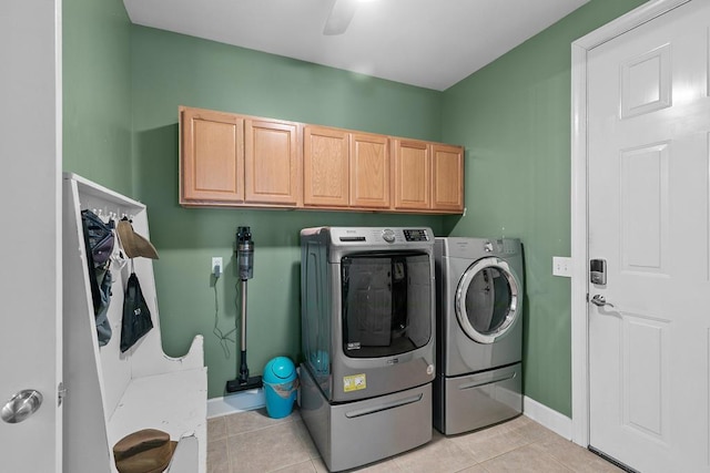 306 Halifax Dr, Dothan, AL 36305 - laundry area with washing machine and clothes dryer, cabinet space, and light tile patterned flooring