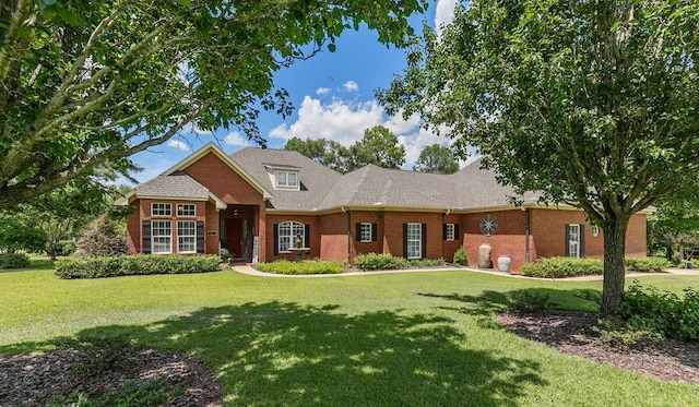 306 Halifax Dr, Dothan, AL 36305 - view of front facade featuring brick siding and a front yard