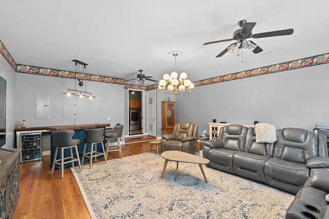 306 Halifax Dr, Dothan, AL 36305 - living room with beverage cooler, ceiling fan, bar area, and wood finished floors