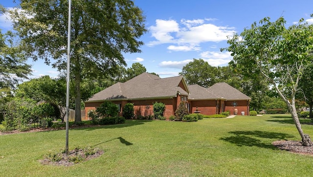 306 Halifax Dr, Dothan, AL 36305 - view of side of home featuring a lawn and brick siding