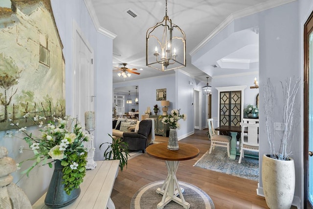 306 Halifax Dr, Dothan, AL 36305 - dining space with a chandelier, wood finished floors, ornamental molding, and a ceiling fan